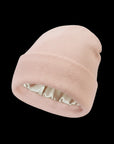 The Cozeo™ hair wellness essentials featuring our signature friction-free pink satin-lined beanie